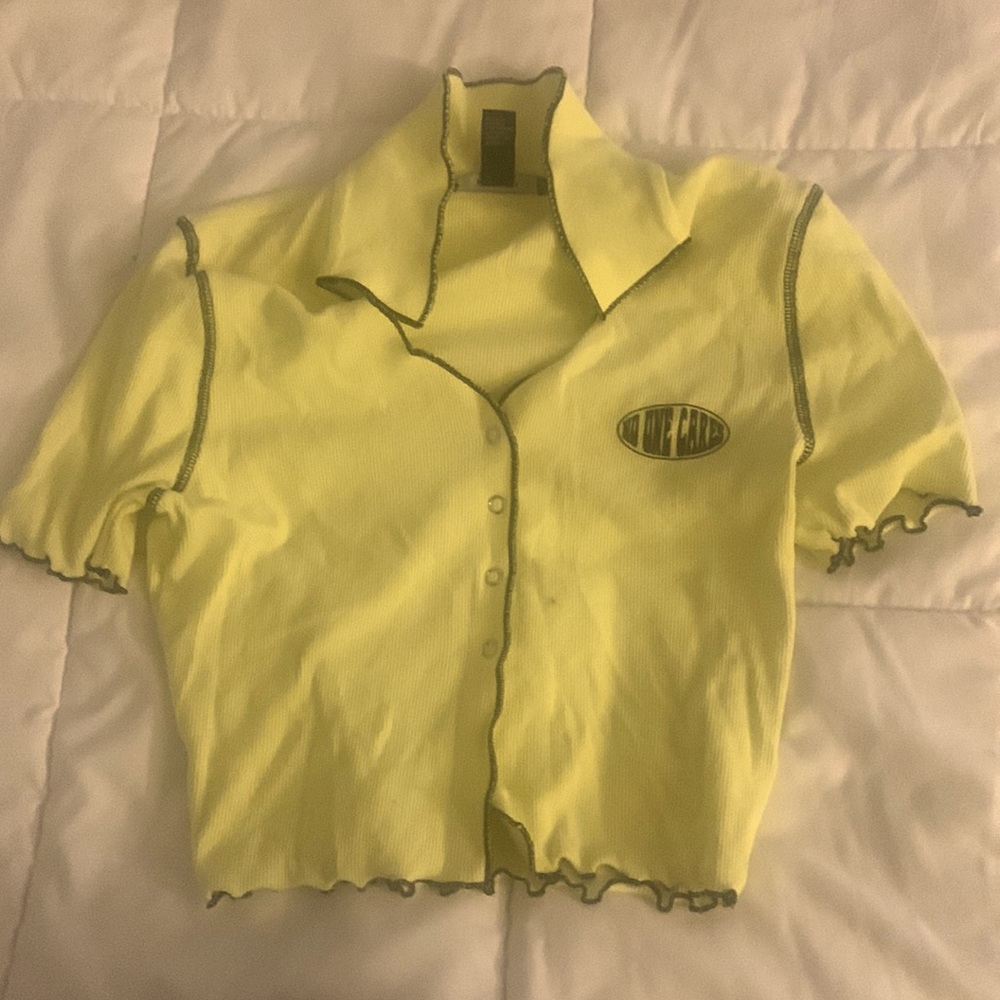 yellow buttoned top